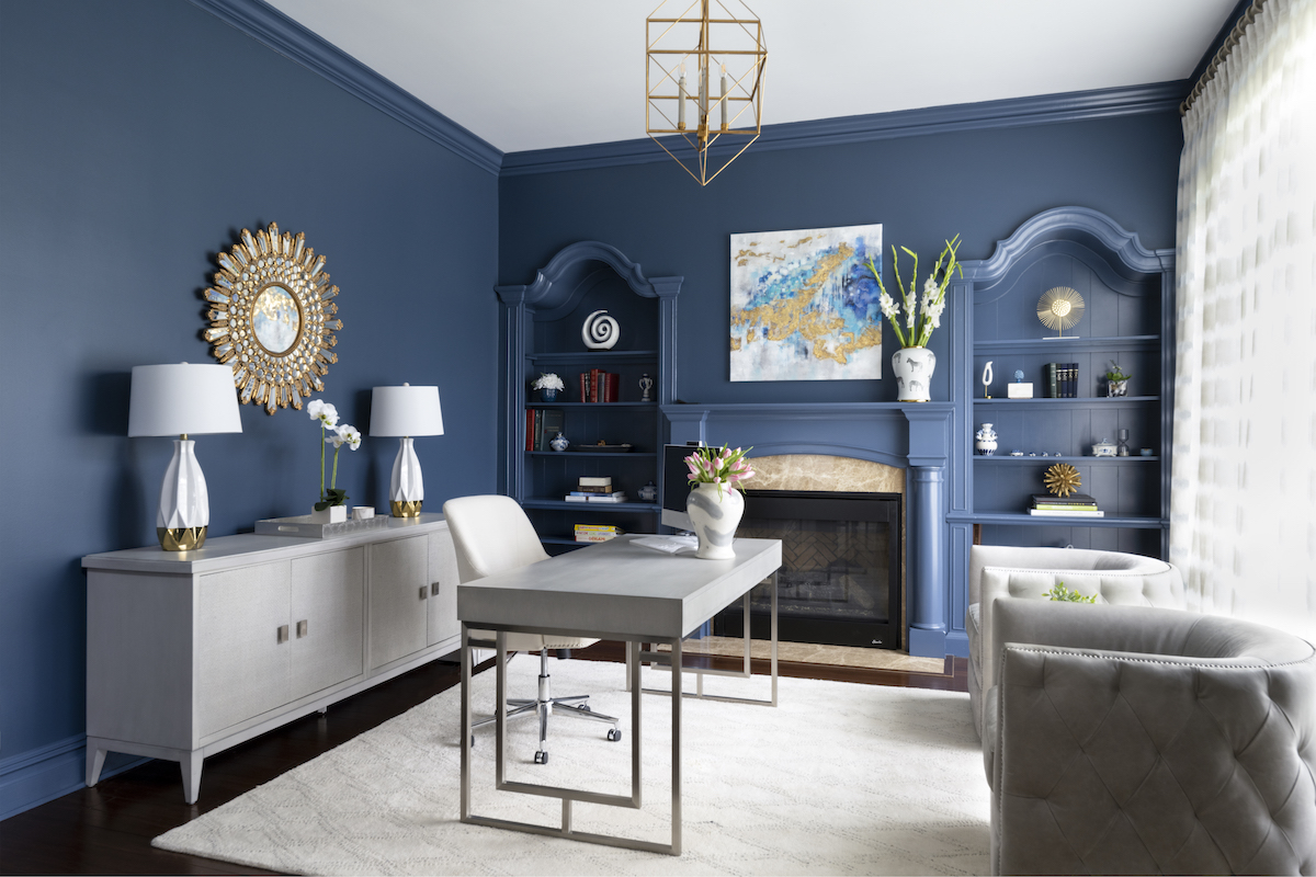 Dark wood has been replaced in the office with the cheerful blue of Benjamin Moore’s Van Deusen, chosen for its beauty when saturated, DiGiacomo says.