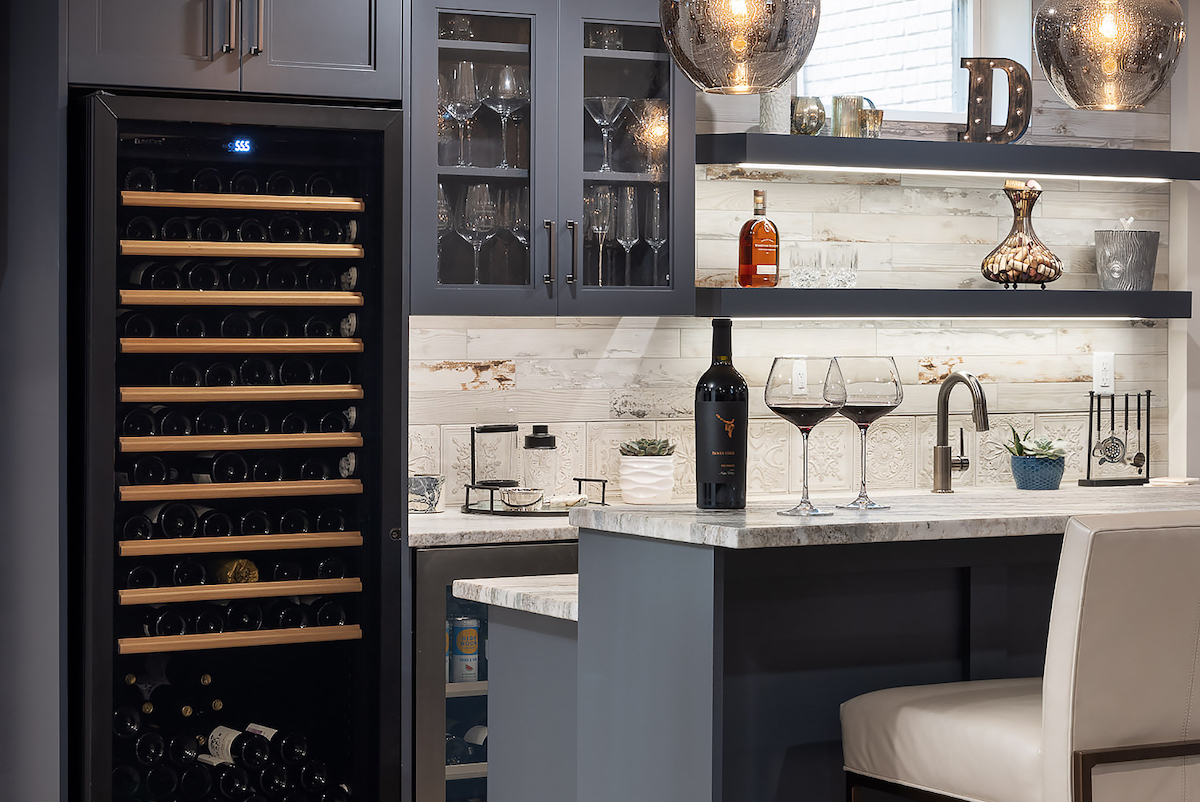 From the EuroCave wine refrigerator to the pendants resembling goblets, the bar’s details are a toast to the homeowner, an avid wine enthusiast.