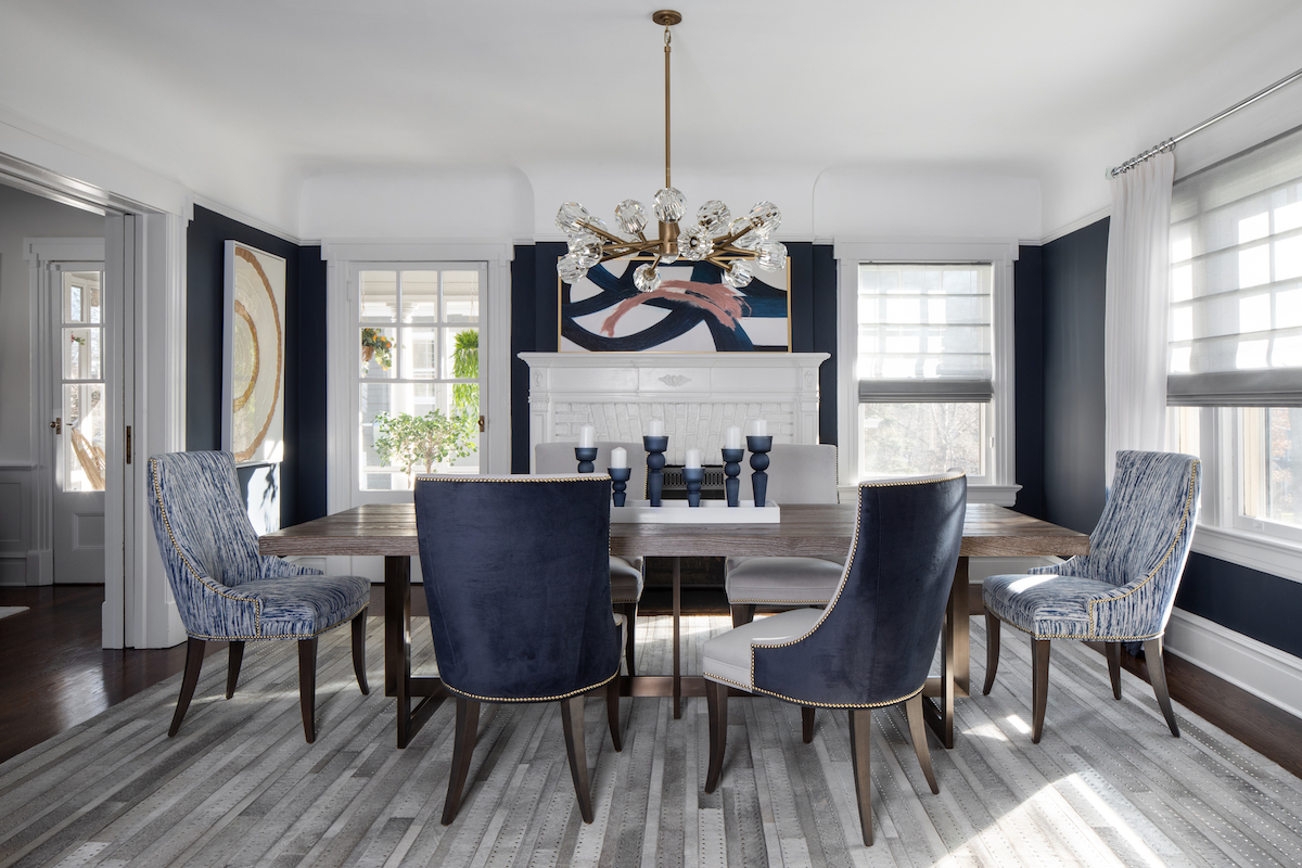 Cool blues, in the Precedent dining chairs and the Castell Luxe rug, and metallics, in the art glass chandelier from Viz, give the dining room a dressy look.