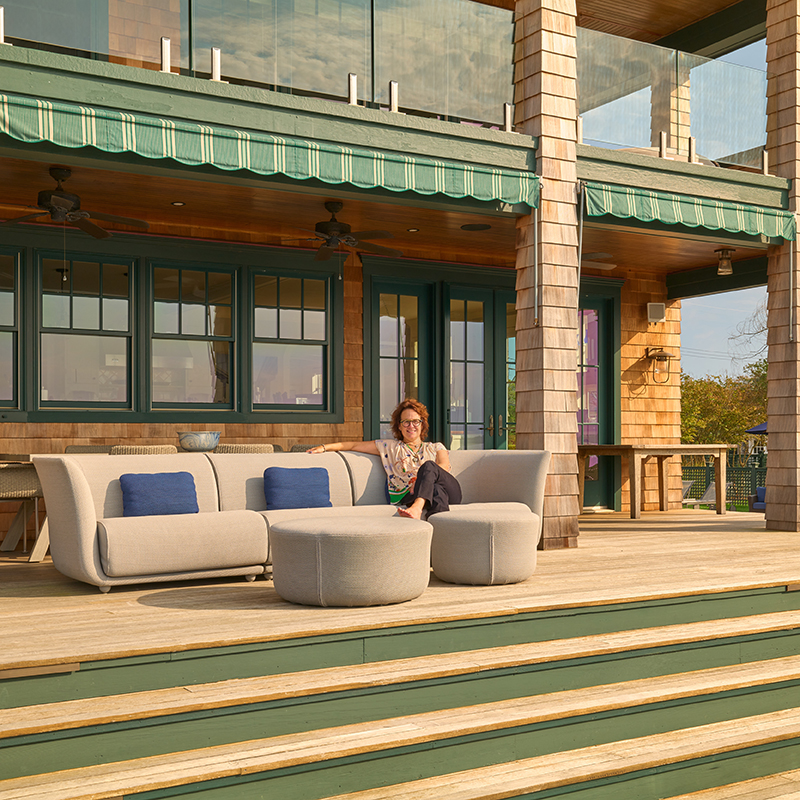 Designer Knauss, pictured here on a Vondom sofa, enjoys the deck area with a plethora of seating she helped to create.