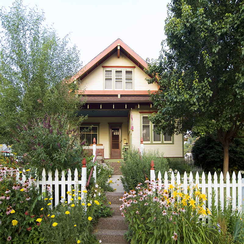 Bungalow House with White Picket Fence