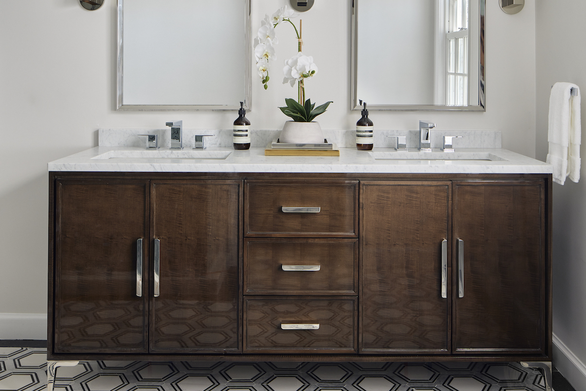 The RH Benoit sable-veneered vanity, Carrara countertop and Viviano Marmo mosaic flooring enhance the primary bathroom’s spa-like appeal. 