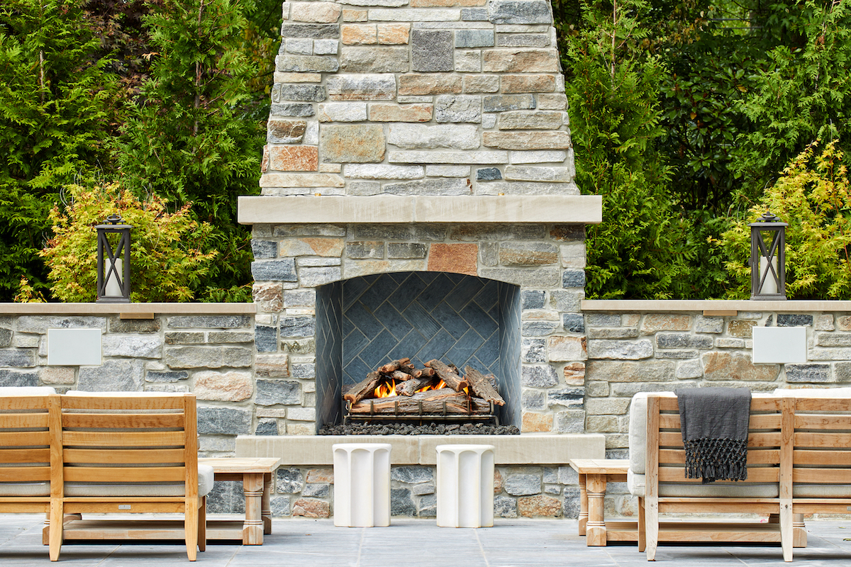 Built from scratch, this fireplace highlights stone meticulously harvested from different vendors to match the house.