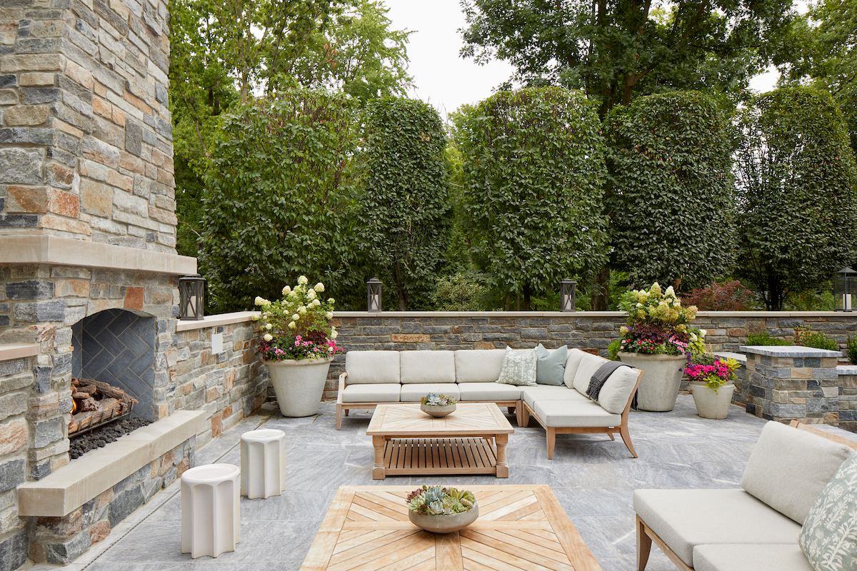 With attention to every detail, builder Mike Mroz moved this fireside seating cluster a safe distance from kids splashing in the pool.
