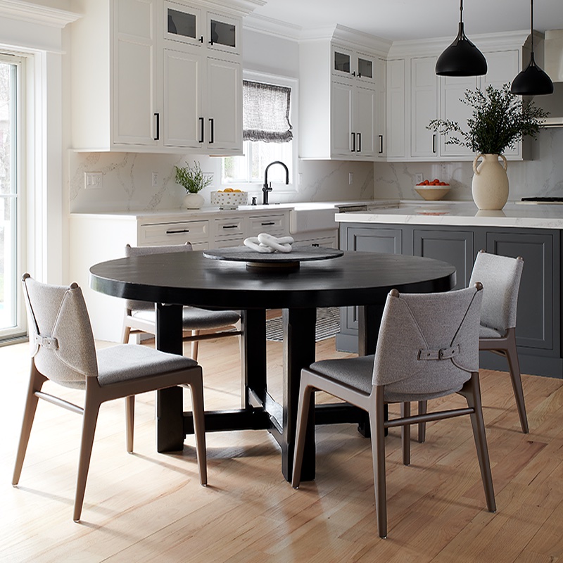 The round shape of the solid wood Sierra Living Concepts table maximizes the flow of the informal dining section, situated between the kitchen and family room. Photo - copyright -Rebecca McAlpin